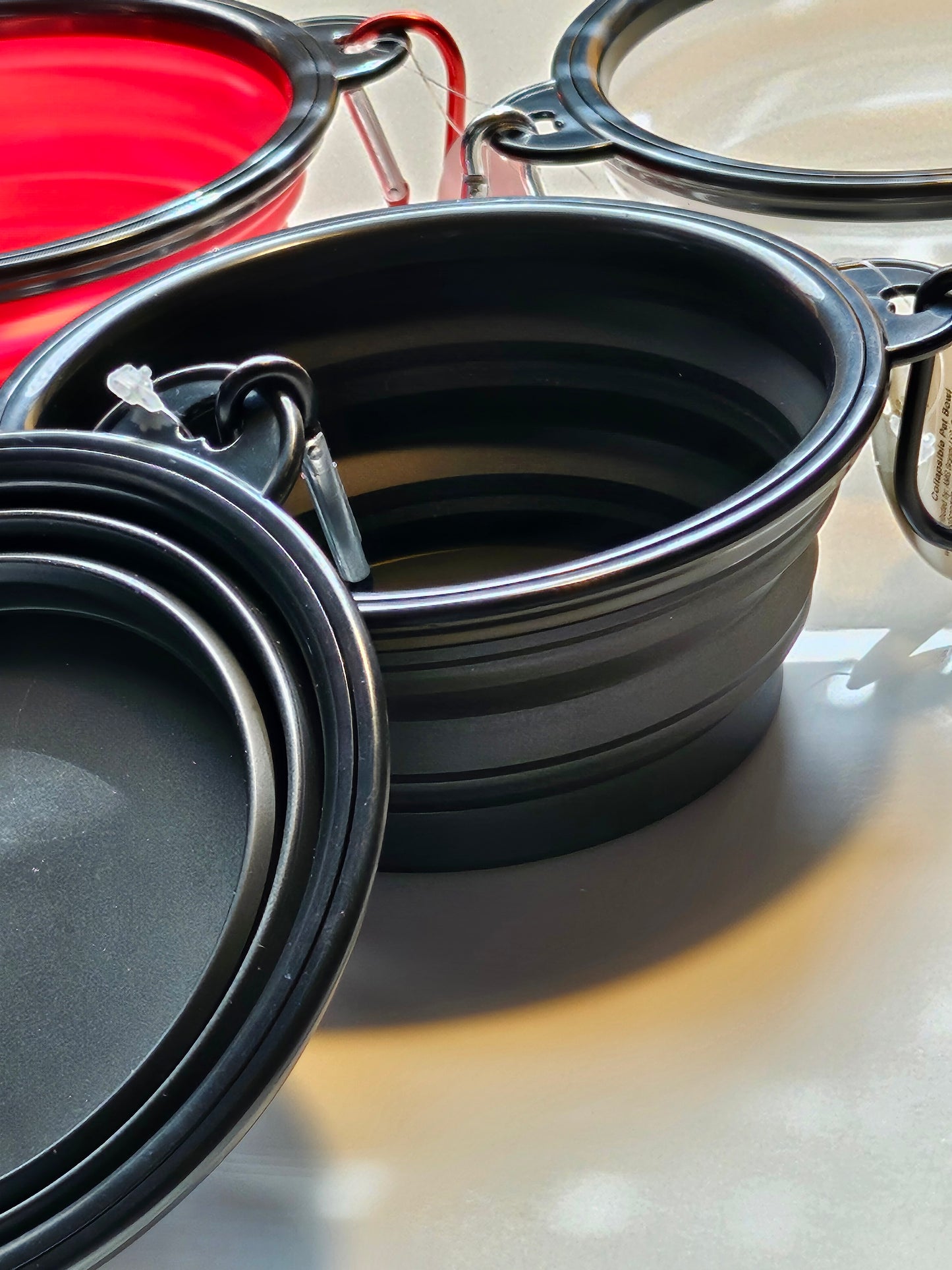 2 pack matching collapsible travel pet bowls with hooks.