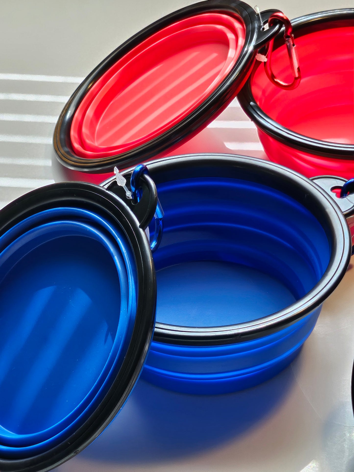2 pack matching collapsible travel pet bowls with hooks.