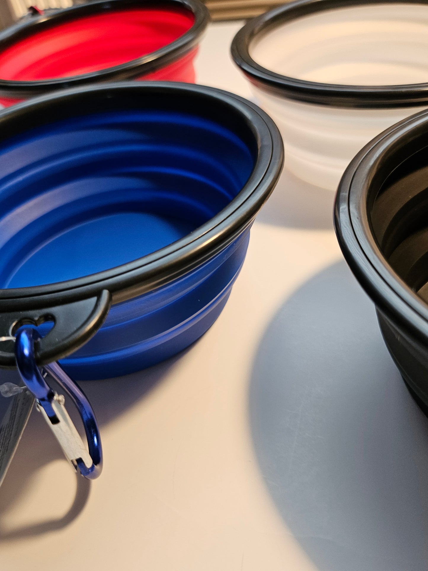 2 pack matching collapsible travel pet bowls with hooks.