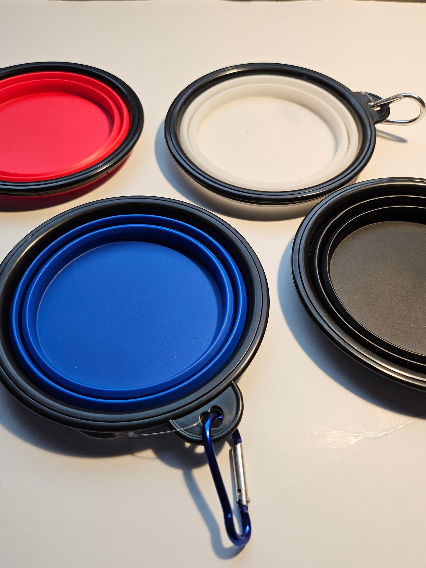 2 pack matching collapsible travel pet bowls with hooks.