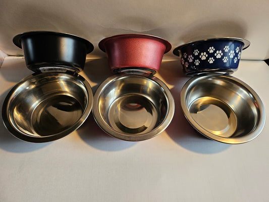 Stainless steel pet bowls for feeding and watering cats and dogs .