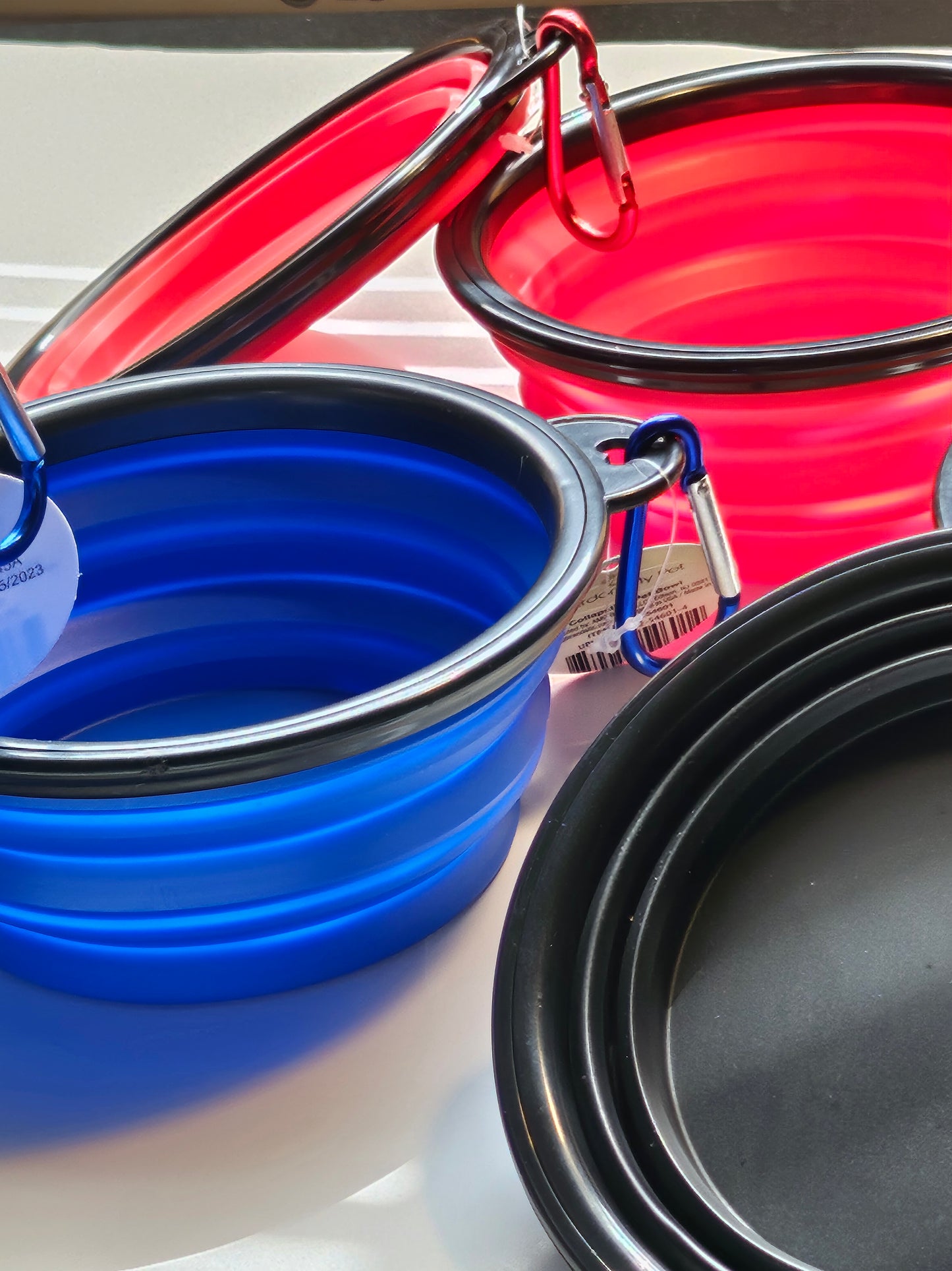 2 pack matching collapsible travel pet bowls with hooks.